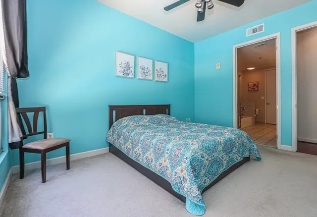 a bedroom with a bed and a chair