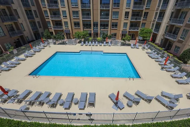 a room with lots of furniture and a rug