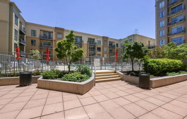 a view of a building with sitting area