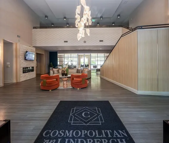 a view of living room with furniture and a fireplace