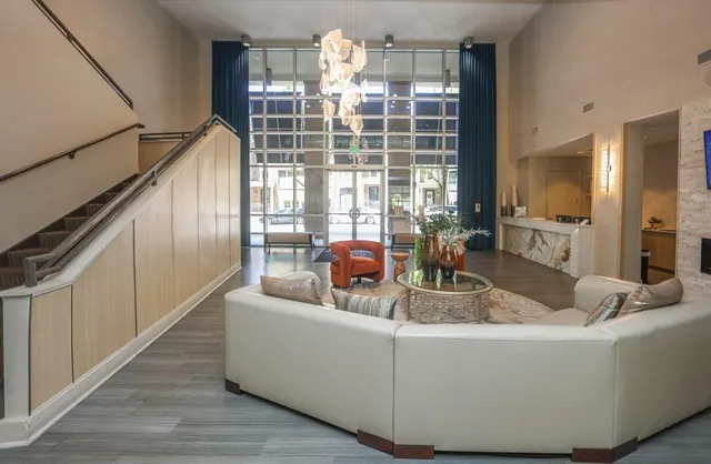 a view of living room with furniture and window