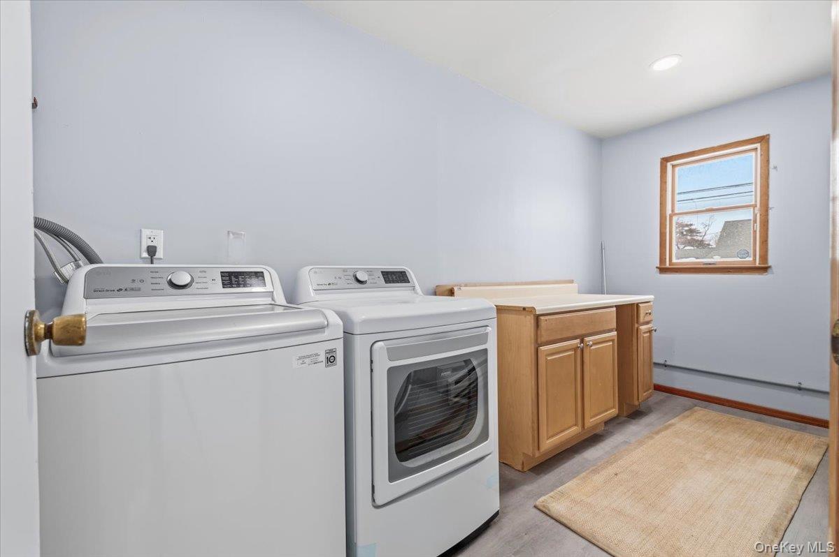89 Ridge Lane Levittown, NY 11756 - Photo 20 of 44 a utility room with dryer and washer