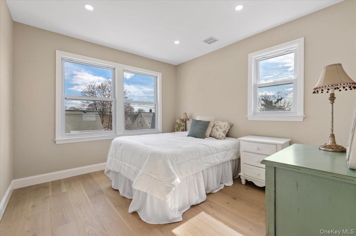 89 Ridge Lane Levittown, NY 11756 - Photo 32 of 44 a bedroom with a bed and a window