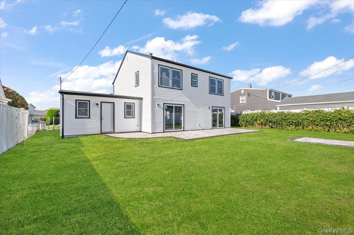 89 Ridge Lane Levittown, NY 11756 - Photo 36 of 44 a view of an house with backyard and garden