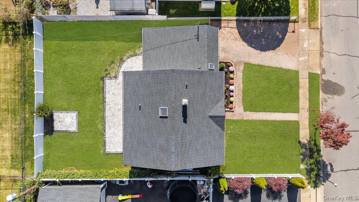89 Ridge Lane Levittown, NY 11756 - Photo 38 of 44 an aerial view of a house with a garden