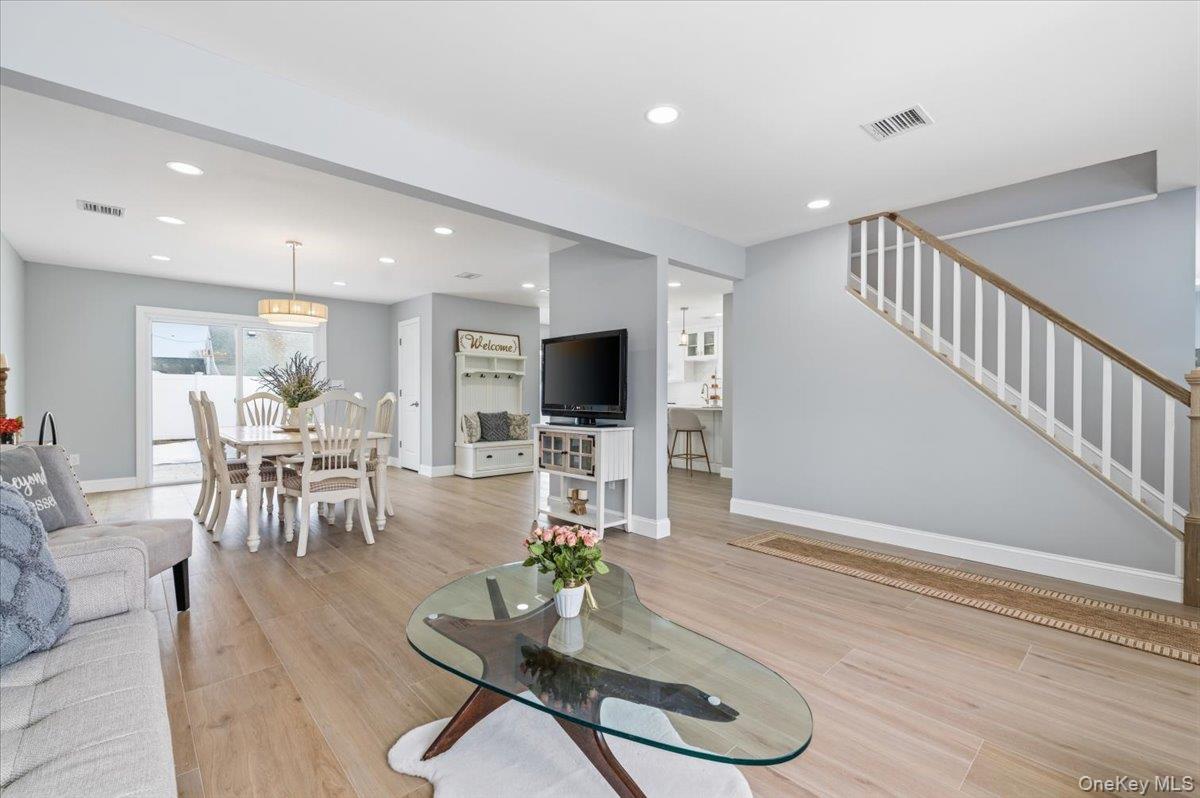89 Ridge Lane Levittown, NY 11756 - Photo 41 of 44 a living room with furniture floor to ceiling window and pool table