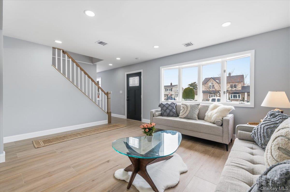 89 Ridge Lane Levittown, NY 11756 - Photo 9 of 44 a living room with furniture and a large window
