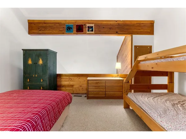 a bedroom with a bed and a cabinets