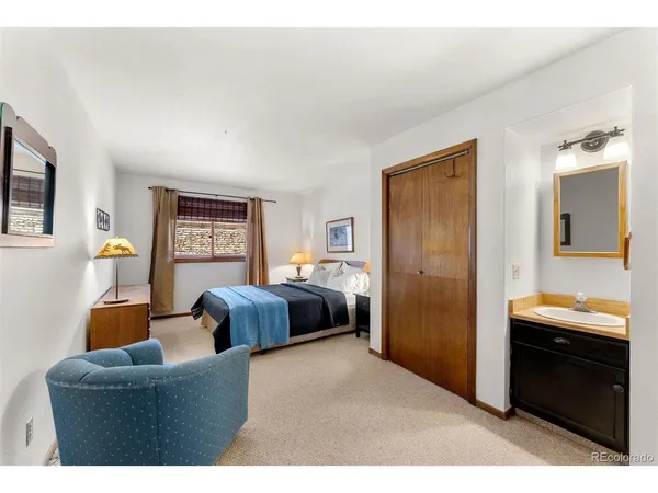 a bedroom with furniture and a window