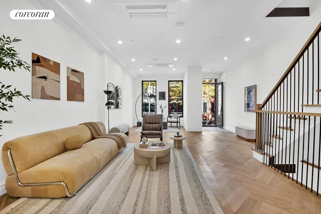 a living room with furniture and white walls