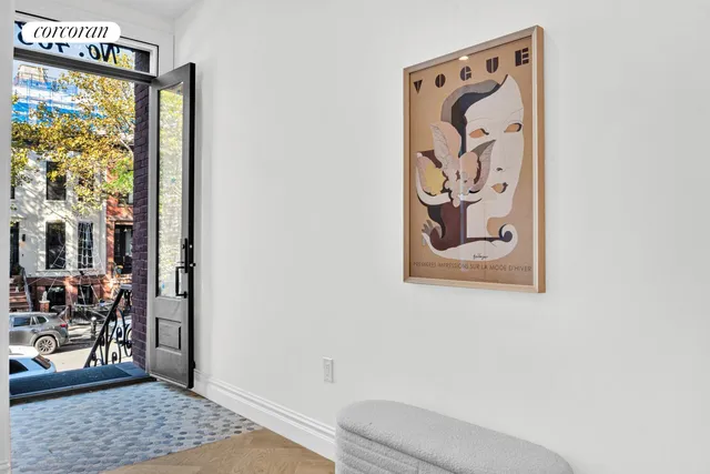 a bathroom with a window and a potted plant