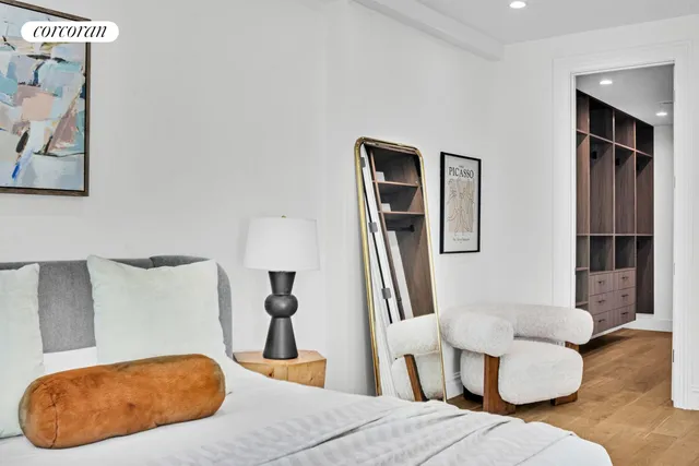 a bedroom with a bed and a couch