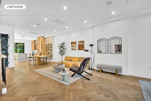 a living room with furniture and white walls