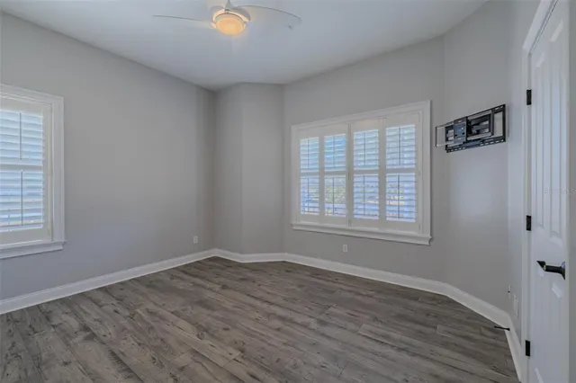 a view of livingroom with hardwood floor and a ceiling fan