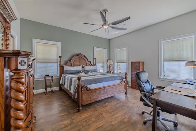 a bedroom with a bed and a table