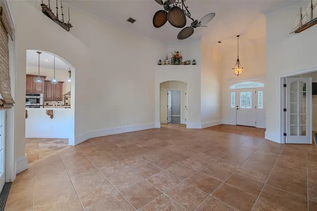 a spacious kitchen with stainless steel appliances granite countertop a stove a sink dishwasher and a wooden cabinets