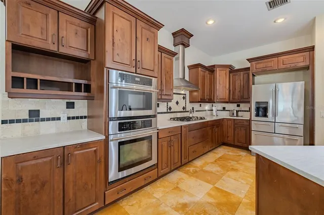 a view of empty room with windows and ceiling fan