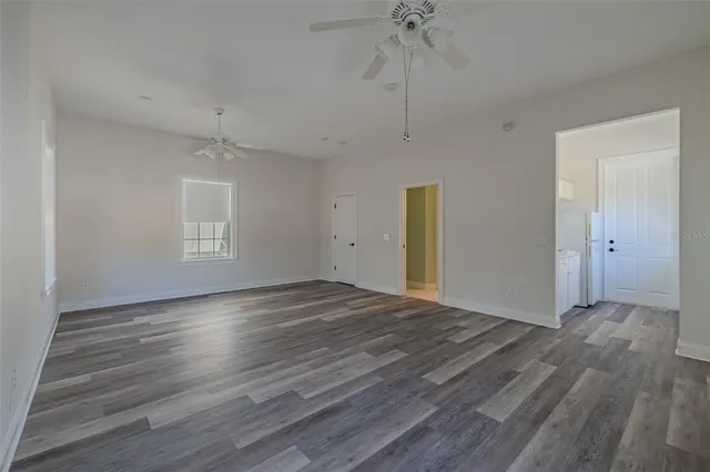 a view of a house with backyard porch and sitting area