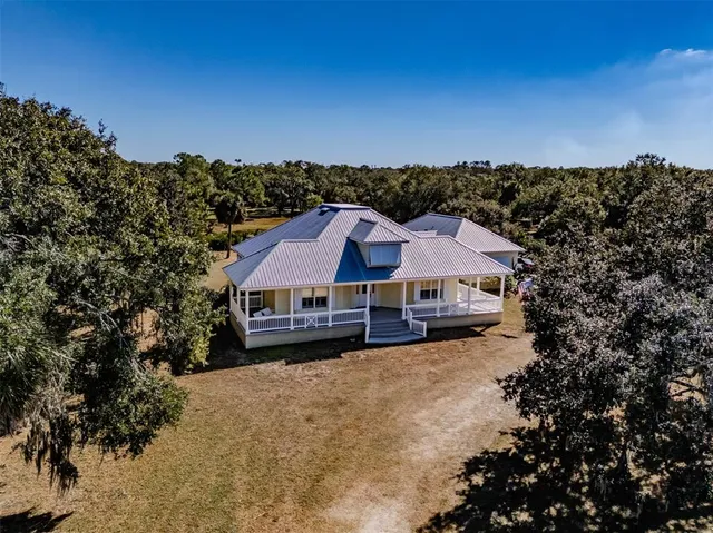 an aerial view of residential building and lake
