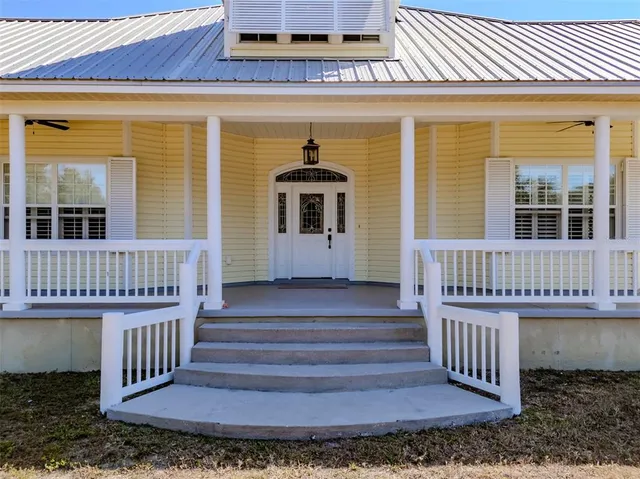 a view of a house with a window and wooden floor