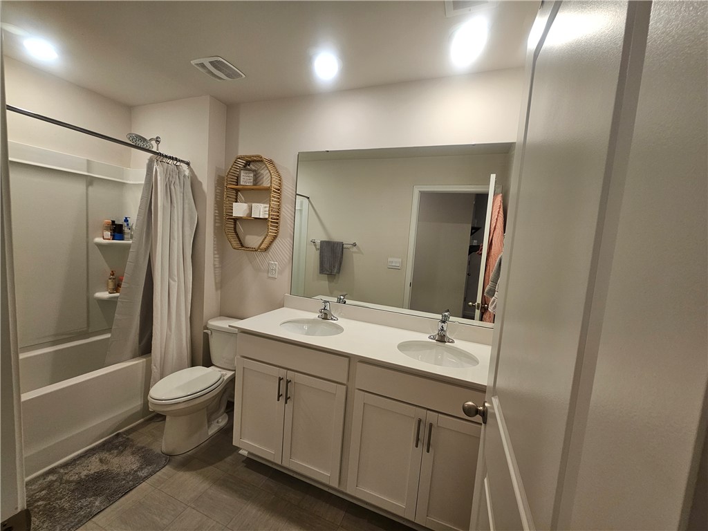 902 Ashwood Lane Easley, SC 29640 - Photo 36 of 39 Double vanity with ample storage and a contemporary shower-tub combination create a functional space.