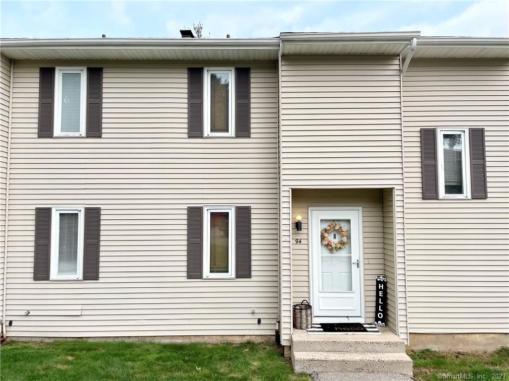 94 Spring Lane, Unit 94 Suffield, CT 06078 - Photo 1 of 1 a front view of a house