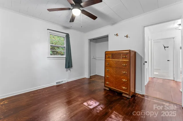 a view of an entryway with wooden floor