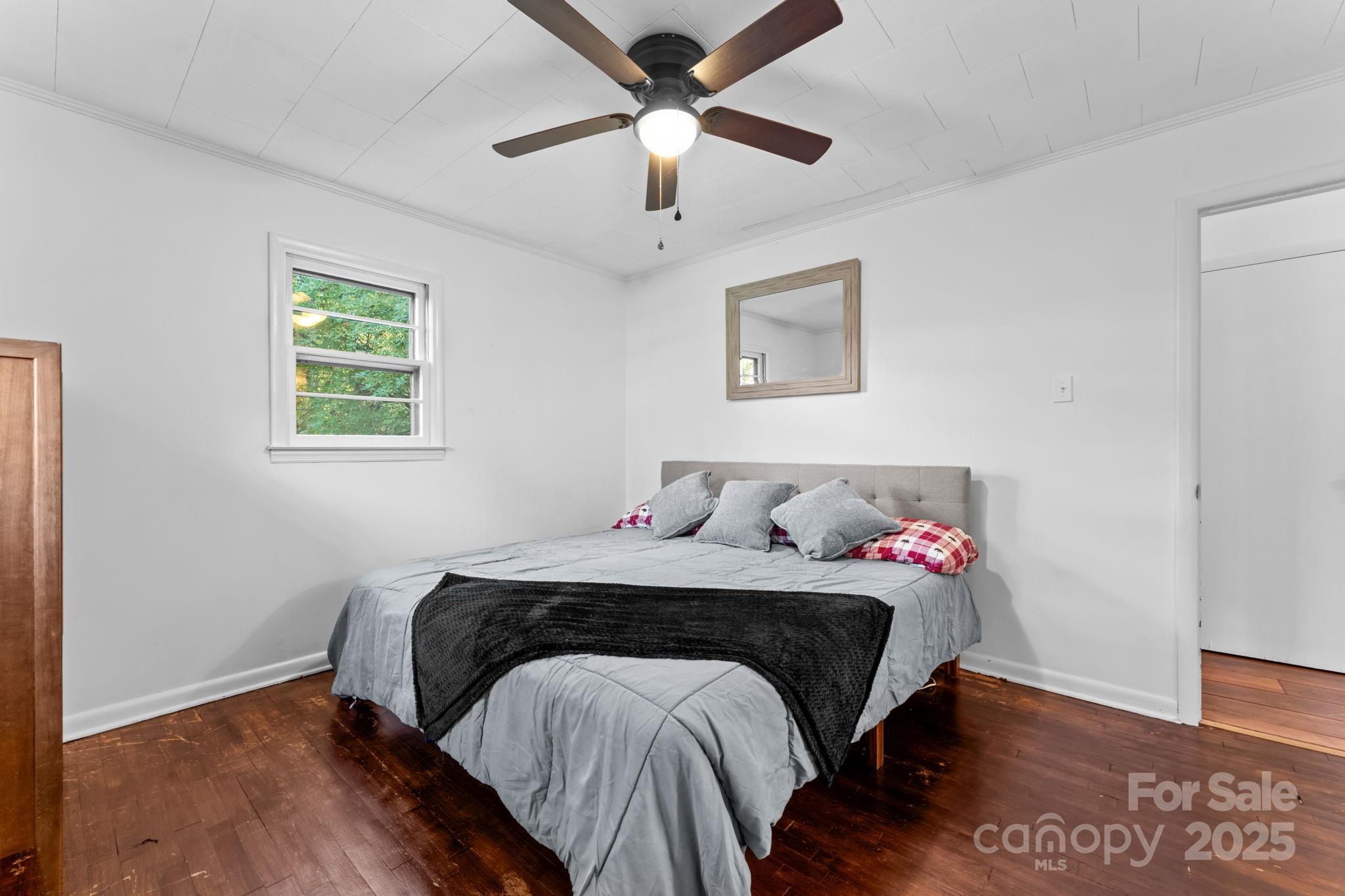 621 Kitchens Branch Road Sylva, NC 28779 - Photo 22 of 29 a bedroom with a bed and a window