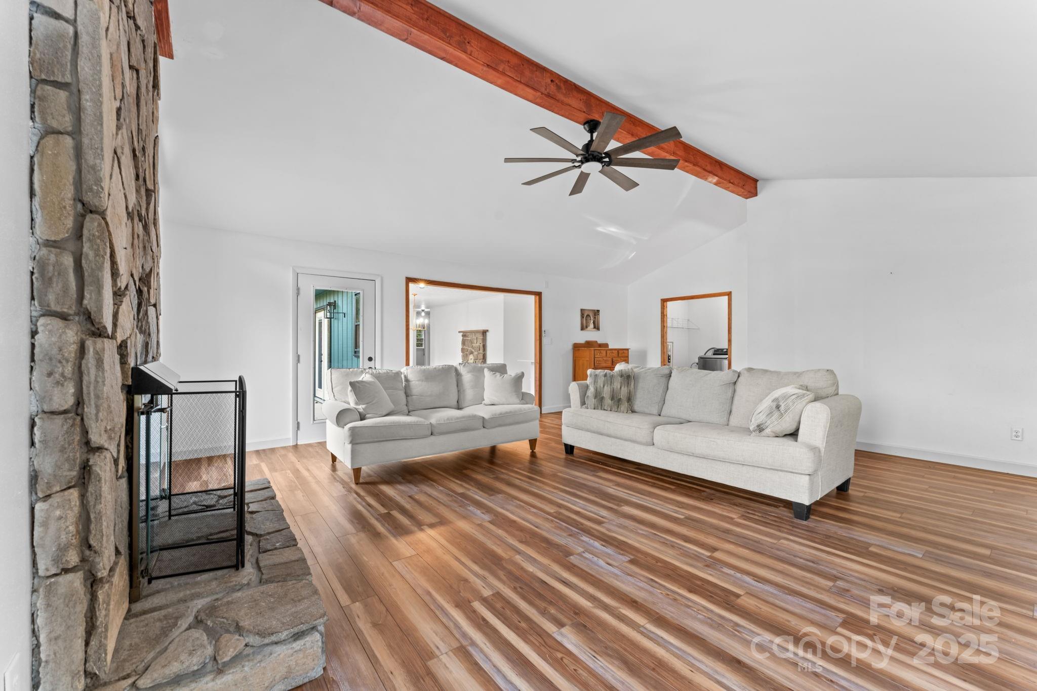 621 Kitchens Branch Road Sylva, NC 28779 - Photo 5 of 29 a living room with furniture and a ceiling fan