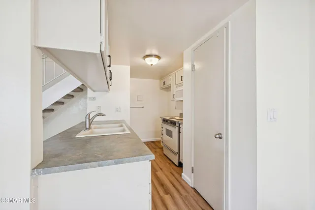 a bathroom with a sink a vanity and a mirror