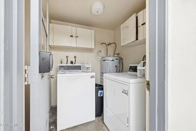 a view of a house with a yard and lake