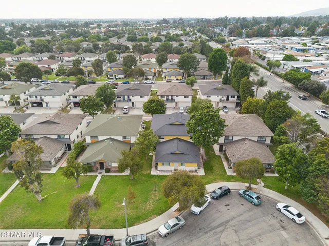 a aerial view of a house with a yard
