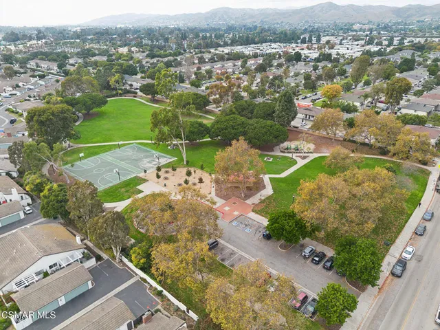 a picture of a park with a white wall