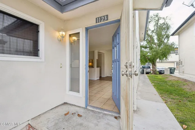 a view of an entryway with wooden floor