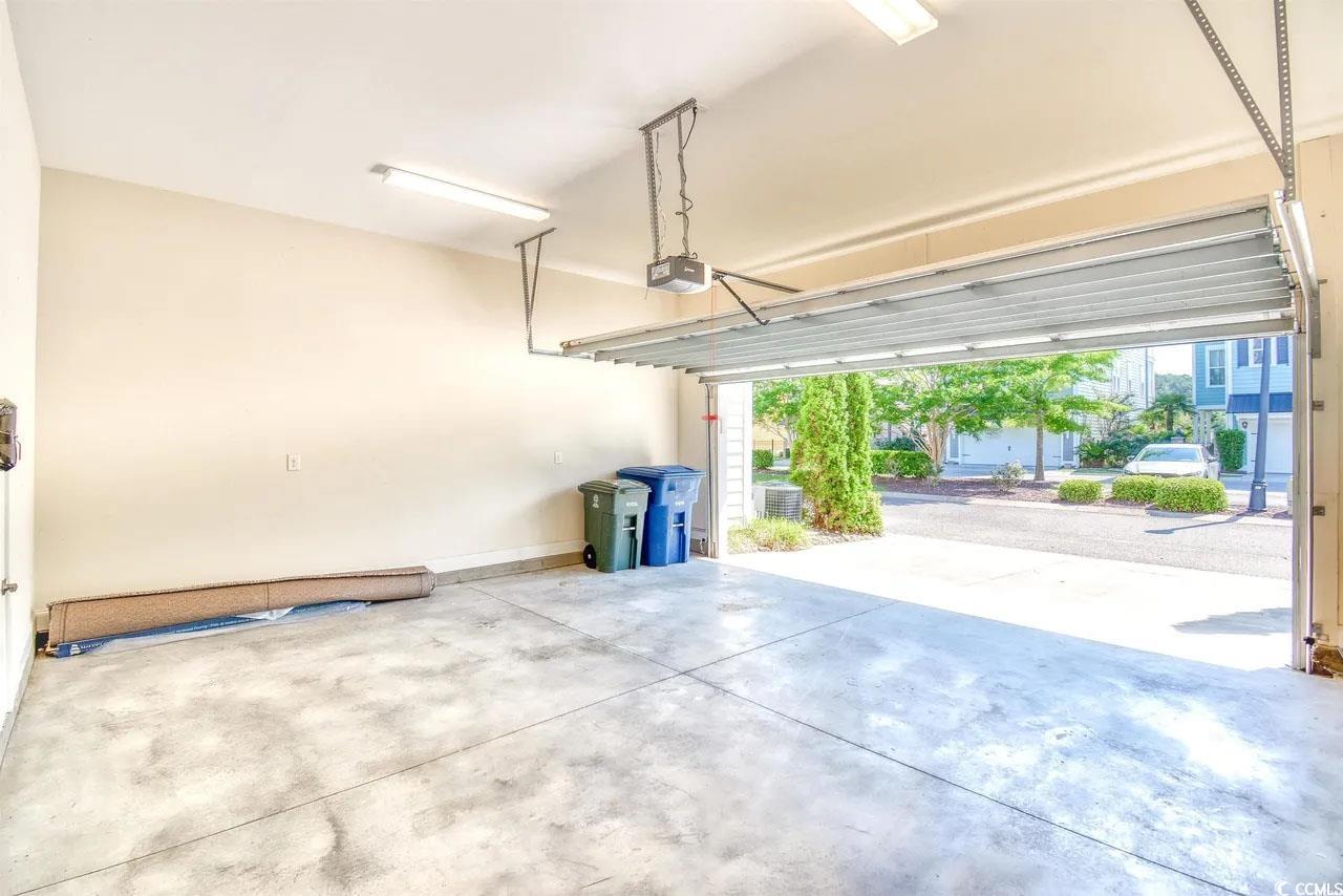 750 Shine Avenue, Unit 750 Myrtle Beach, SC 29577 - Photo 11 of 34 Garage with a garage door opener