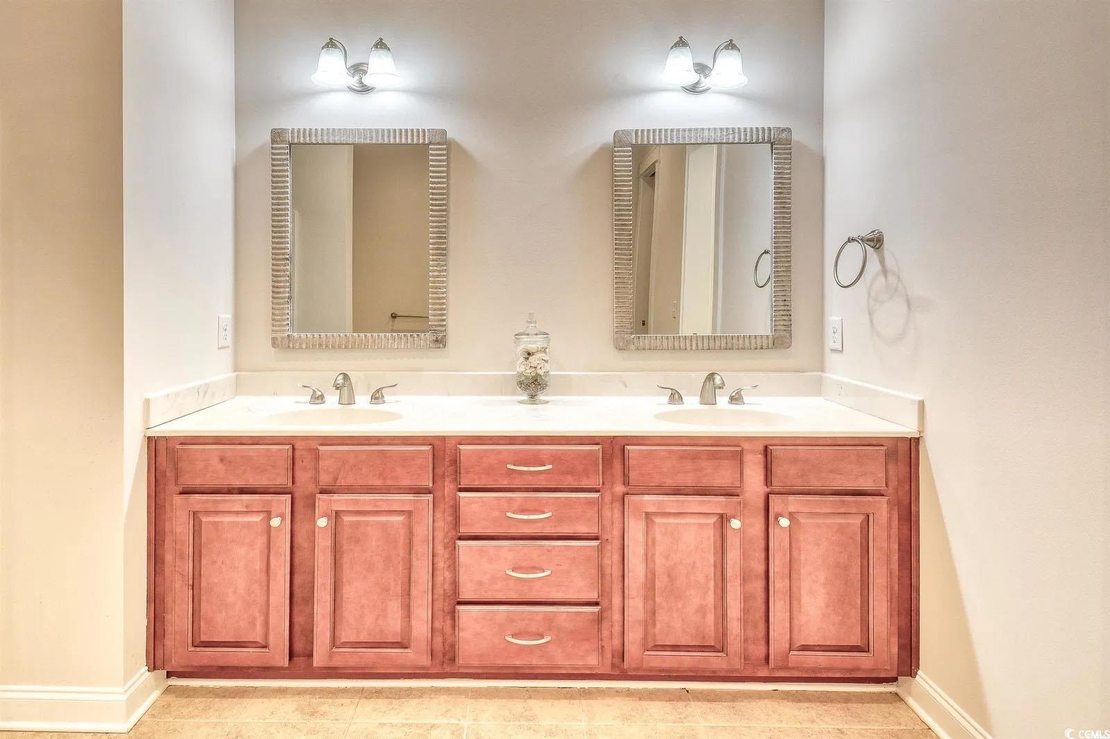 750 Shine Avenue, Unit 750 Myrtle Beach, SC 29577 - Photo 14 of 34 Full bathroom with double vanity and light tile patterned floors