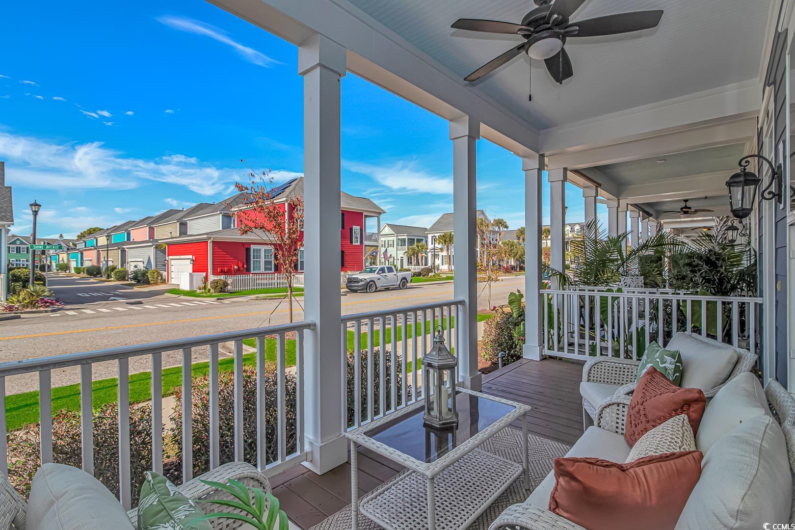750 Shine Avenue, Unit 750 Myrtle Beach, SC 29577 - Photo 21 of 34 Porch featuring ceiling fan and a residential view