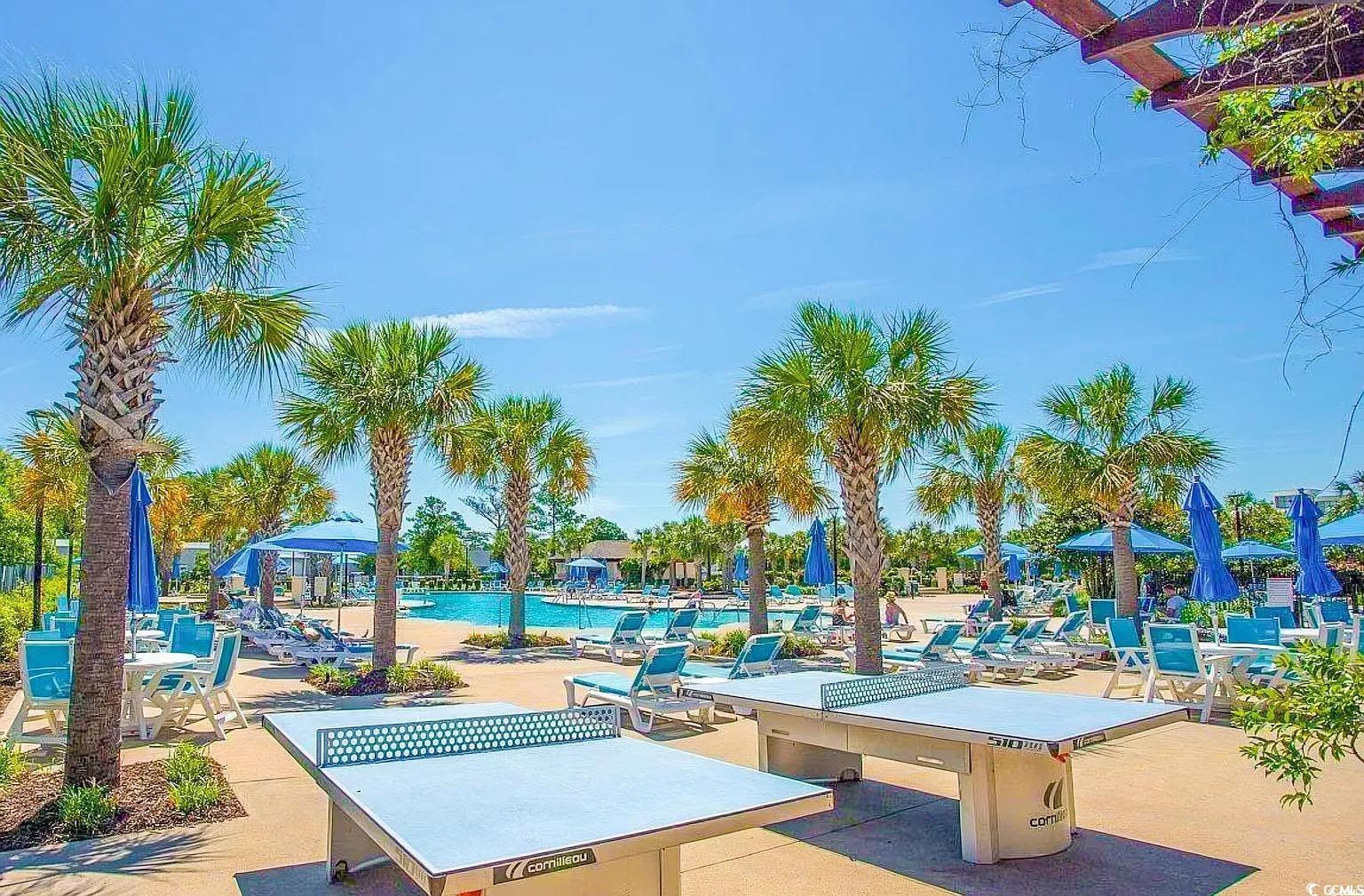 750 Shine Avenue, Unit 750 Myrtle Beach, SC 29577 - Photo 30 of 34 View of community with a patio area and a swimming pool