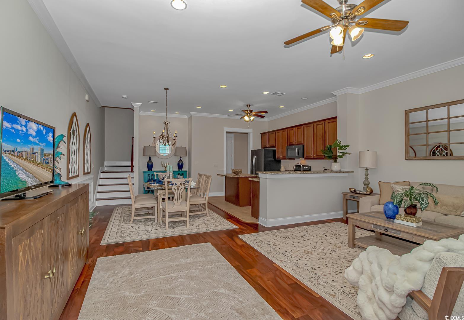 750 Shine Avenue, Unit 750 Myrtle Beach, SC 29577 - Photo 3 of 34 Living area featuring ceiling fan, wood finished floors, ornamental molding, a chandelier, and recessed lighting