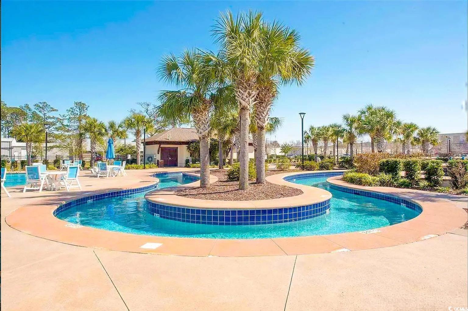 750 Shine Avenue, Unit 750 Myrtle Beach, SC 29577 - Photo 31 of 34 Community pool with a patio