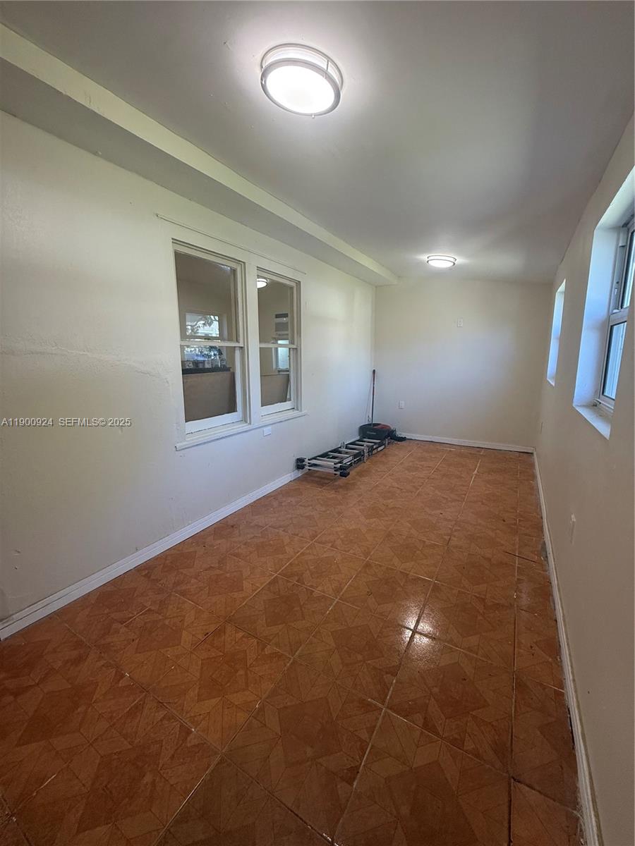 1918 Northwest 82nd Street Miami, FL 33147 - Photo 15 of 15 an empty room with windows