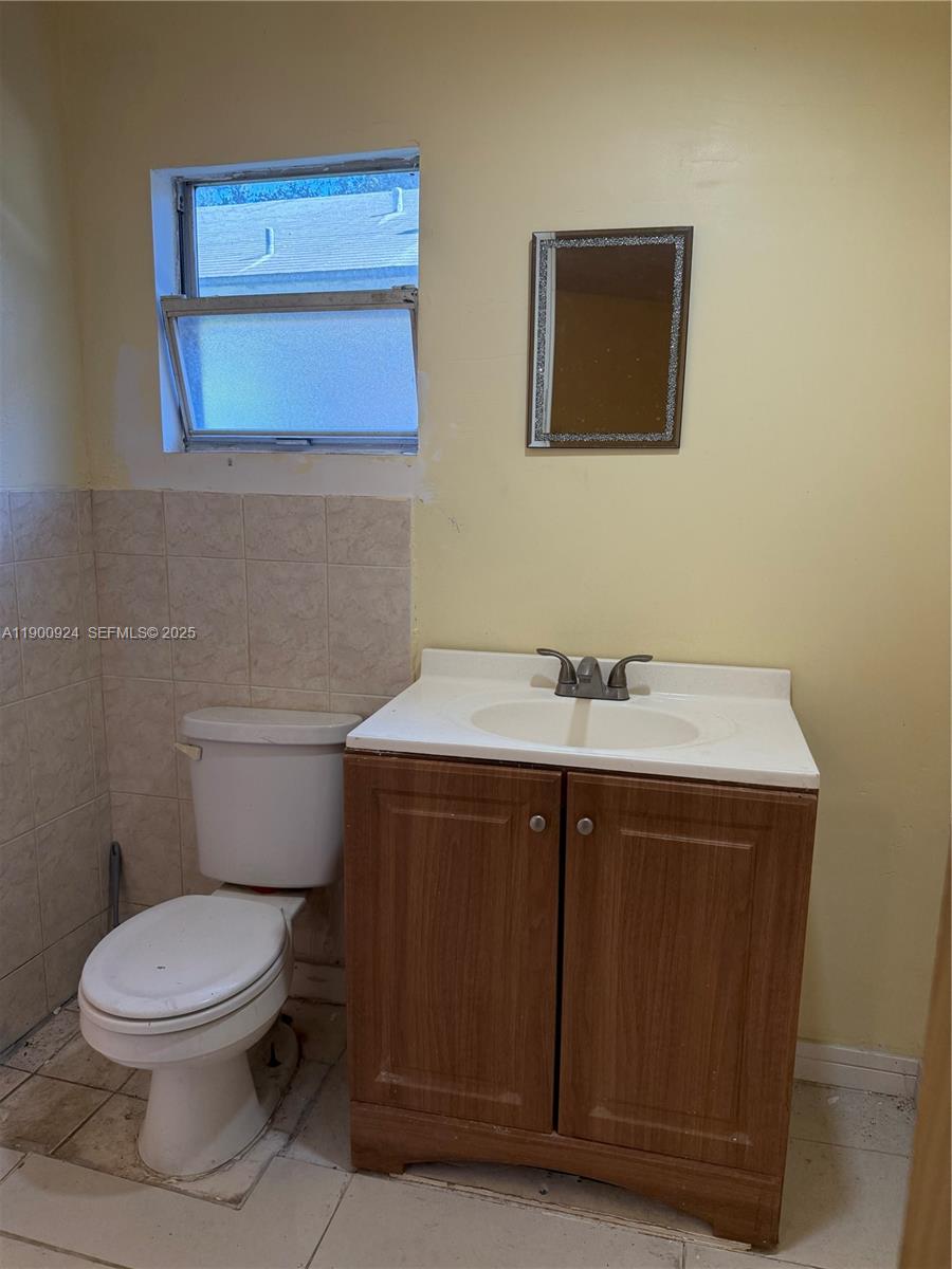 1918 Northwest 82nd Street Miami, FL 33147 - Photo 10 of 15 a bathroom with a sink and a toilet