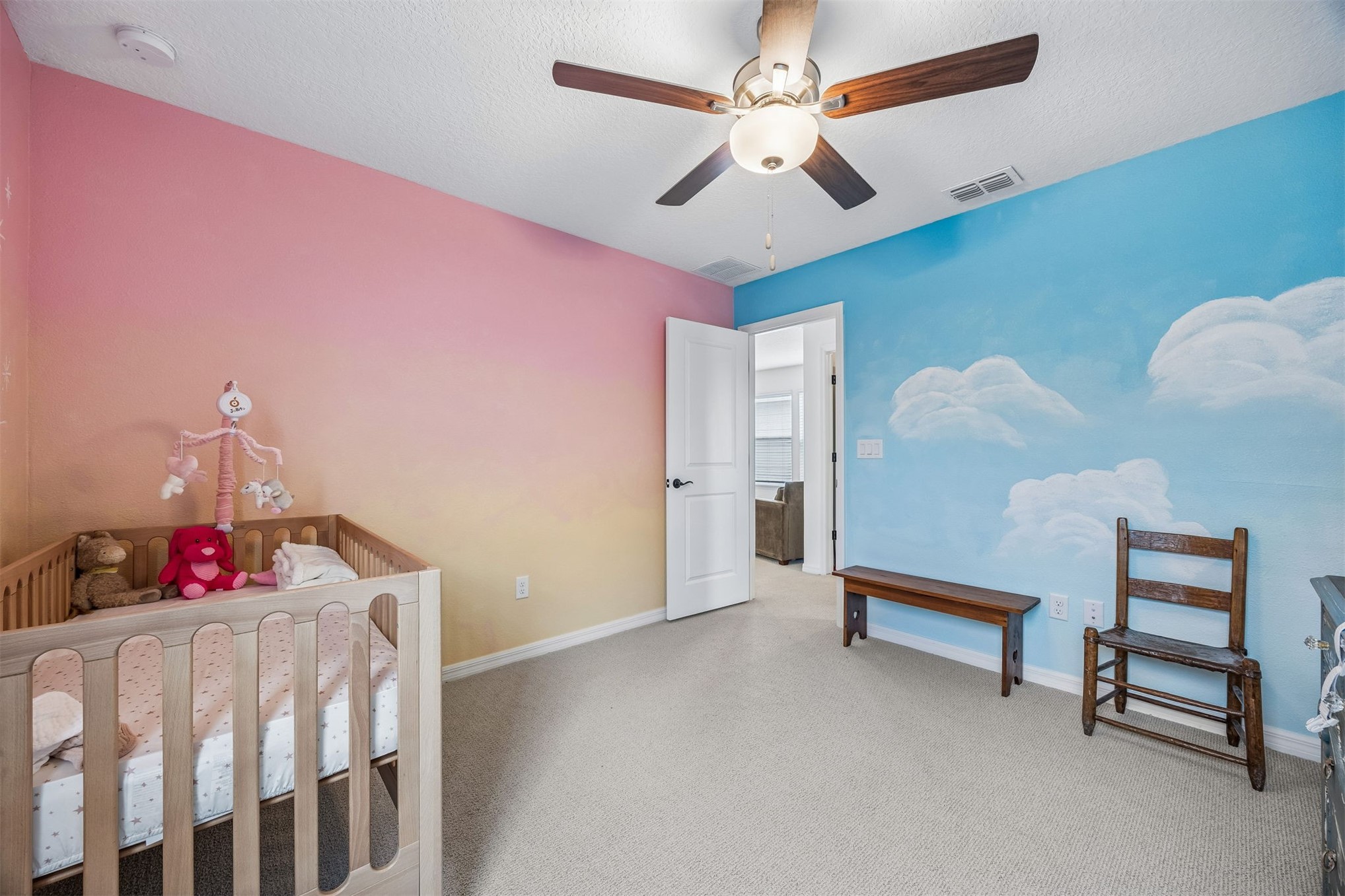 236 Hawthorn Park Circle Yulee, FL 32097 - Photo 20 of 28 a bedroom with furniture and a chandelier
