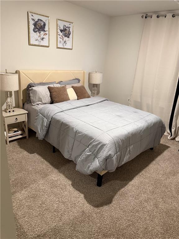 2957 Cottage Lane Atlanta, GA 30337 - Photo 11 of 21 a bedroom with a bed and a painting on the wall