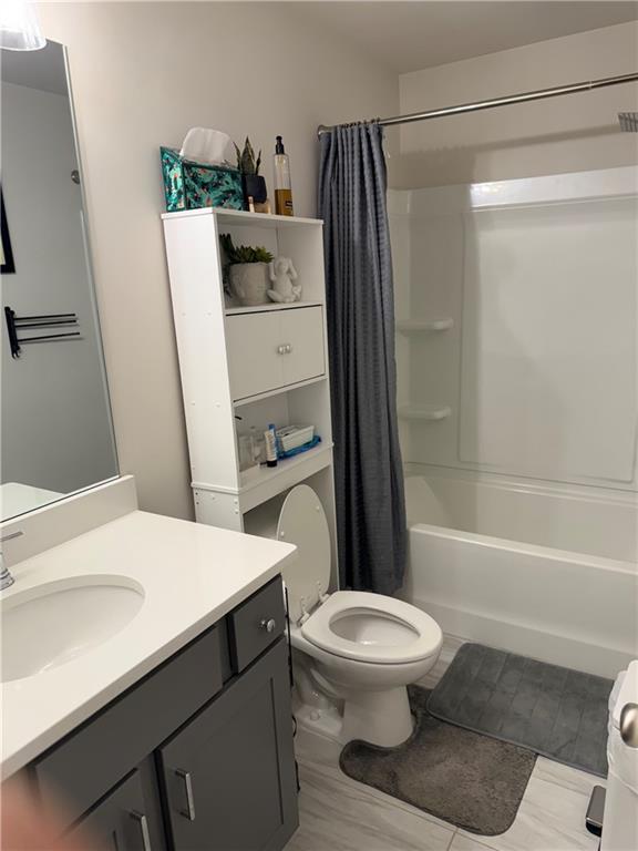 2957 Cottage Lane Atlanta, GA 30337 - Photo 13 of 21 a bathroom with a sink a toilet and shower