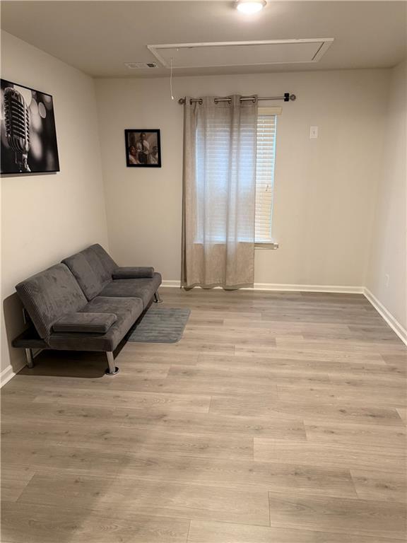 2957 Cottage Lane Atlanta, GA 30337 - Photo 14 of 21 a living room with furniture and a rug