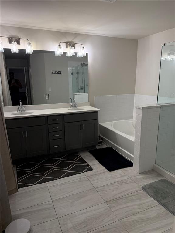 2957 Cottage Lane Atlanta, GA 30337 - Photo 18 of 21 a bathroom with a double vanity sink and mirror