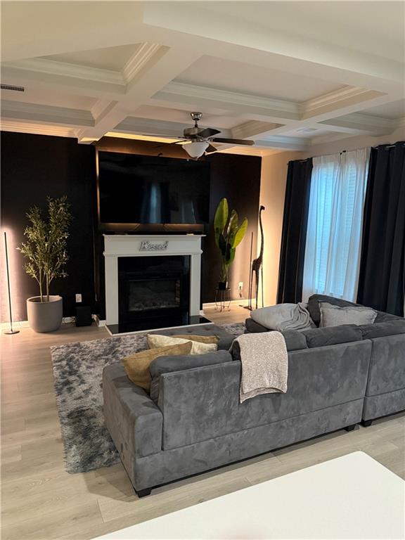 2957 Cottage Lane Atlanta, GA 30337 - Photo 2 of 21 a living room with furniture a fireplace and a flat screen tv