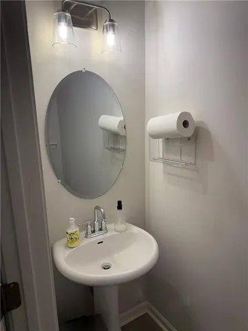 a bathroom with a sink and mirror