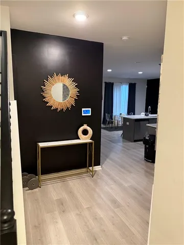 a view of an empty room with kitchen equipment